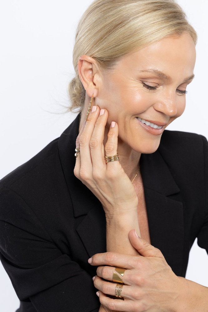 Black blazer — jewellery close-up